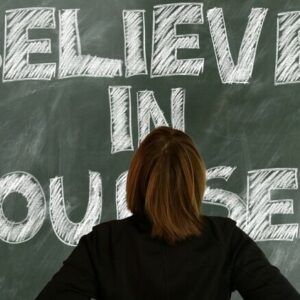 a persson in front of the words Believe in yourself to inforce the importance of self-esteem to each of us and how family communications group can help.